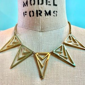 Triangular boho chic gold tone statement necklace.
